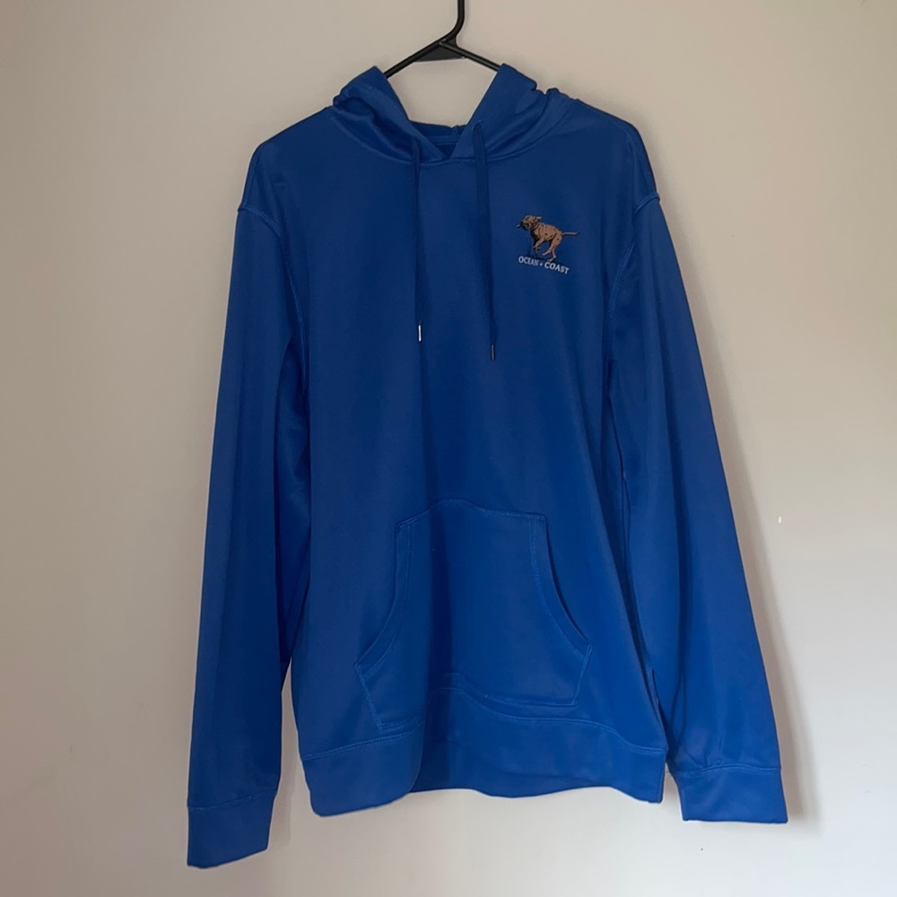 blue 100% polyester ocean + coast sweatshirt with with dog on front and back